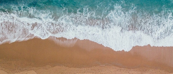 image of a birds-eye view of a relaxing beach